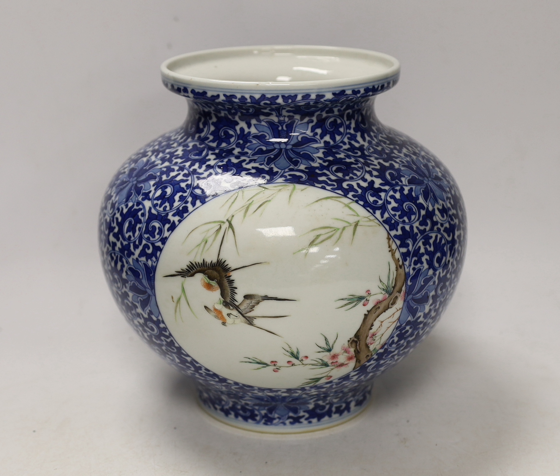 A Chinese enamelled blue and white jar, Qianlong mark, 22cm high